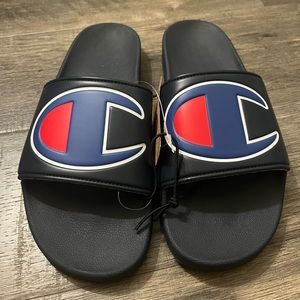 Black champion slides sandals. Size 10. New with tags.